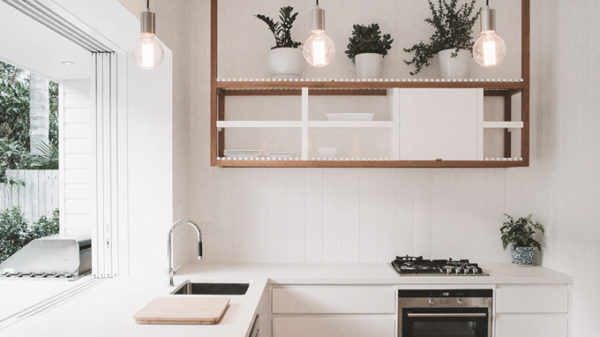 a modern-designed kitchen with plants and cute lightings